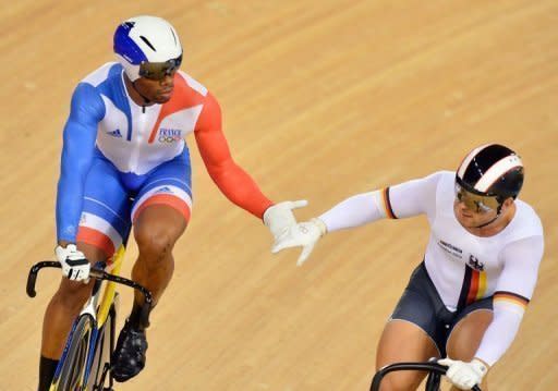 Germany's Robert Forstemann (R) shakes hands with France's Gregory Bauge after the latter crosses the finish line first during the London 2012 Olympic Games men's sprint quarterfinals cycling event at the Velodrome in the Olympic Park in East London on August 5, 2012