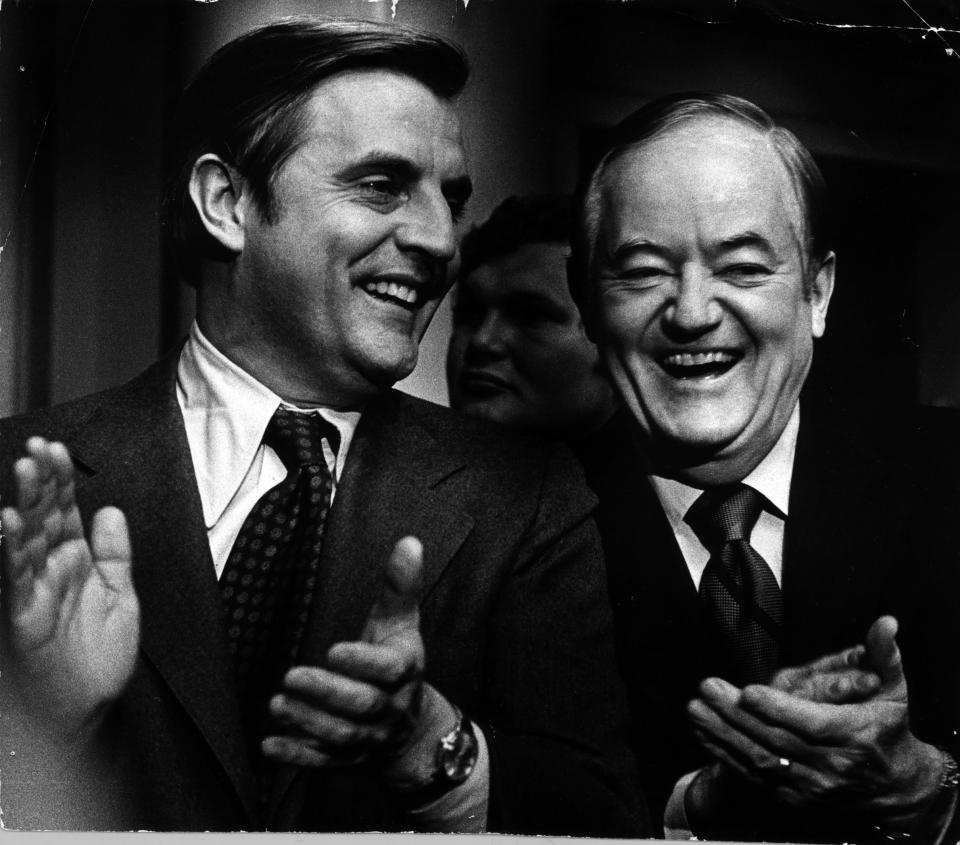 Sens. Walter Mondale (at left) and Hubert Humphrey applaud a fellow DFLer, Minnesota Gov. Wendell Anderson, during Anderson's inaugural message on January 8, 1975, (Kent Kobersteen/Minneapolis Tribune via AP)