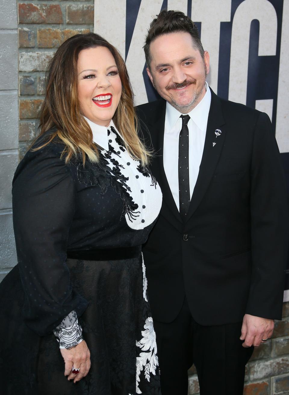 the couple smiling at an event