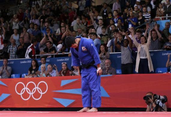 London's ExCel Centre erupted in boos of derision when South Korea's Cho Jun-ho was judged to have beaten Japan's Masashi Ebinuma after a close judo encounter. Startled judges referred their decision to a reviewing jury, which took the unprecedented step of overturning the result. South Korea's Cho Jun-Ho (blue) bows to the judges before leaving the mat area after losing to Japan's Masashi Ebinuma in the men's —66kg quarter— final judo match at the London 2012 Olympic Games July 29, 2012.