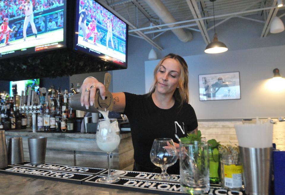 Bartender Ashley Barbosa makes a blueberry basil lemonade. Navillus Bar & Grill has opened in the space Guapo's used to occupy in the Orleans Marketplace.