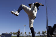 Milwaukee Brewers right fielder Avisail Garcia stretches before a spring training baseball game against the Seattle Mariners, Tuesday, Feb. 25, 2020, in Phoenix. (AP Photo/Gregory Bull)