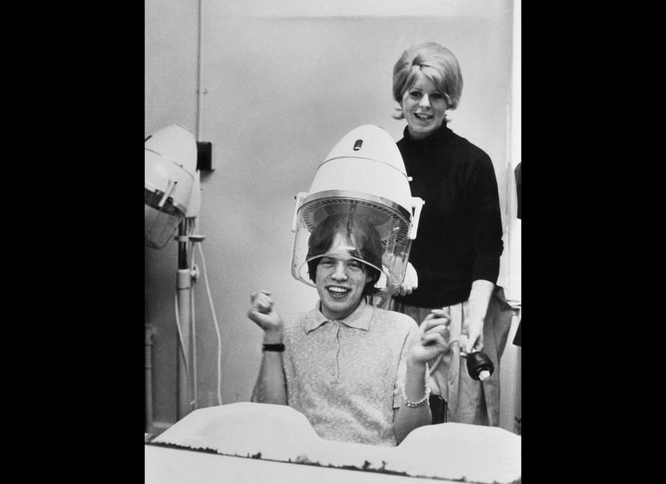 Mick Jagger under a hair dryer in 1964.