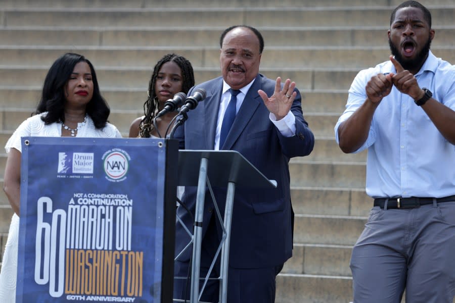 Martin Luther King III (center) speaks as his wife Arndrea King, and daughter <span class="caas-xray-inline-tooltip"><span class="caas-xray-inline caas-xray-entity caas-xray-pill rapid-nonanchor-lt" data-entity-id="Yolanda_King" data-ylk="cid:Yolanda_King;pos:2;elmt:wiki;sec:pill-inline-entity;elm:pill-inline-text;itc:1;cat:Actor;" tabindex="0" aria-haspopup="dialog"><a href="https://search.yahoo.com/search?p=Yolanda%20King" data-i13n="cid:Yolanda_King;pos:2;elmt:wiki;sec:pill-inline-entity;elm:pill-inline-text;itc:1;cat:Actor;" tabindex="-1" data-ylk="slk:Yolanda King;cid:Yolanda_King;pos:2;elmt:wiki;sec:pill-inline-entity;elm:pill-inline-text;itc:1;cat:Actor;" class="link ">Yolanda King</a></span></span> listen during the 60th Anniversary of The March on Washington at the Lincoln Memorial on Aug. 26, 2023, in Washington, D.C. (Photo by Alex Wong/Getty Images)