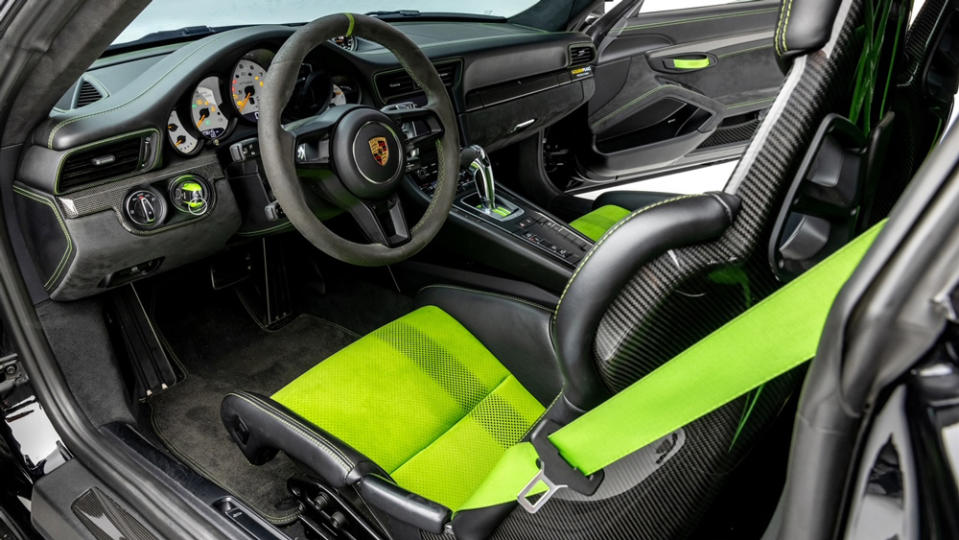 The race-focused interior features accents in Lizard Green, a color also found on the roll cage and brake calipers. - Credit: Photo by Ted Seven, courtesy of Global Motorsports Group.