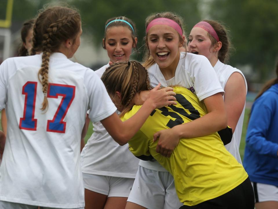 Pleasant Plains' Ella Wilcockson hugs goalkeeper Elle Walker following a 1-0 victory over Sacred Heart-Griffin in the Class 1A Riverton Sectional girls soccer final on Friday, May 19, 2023.