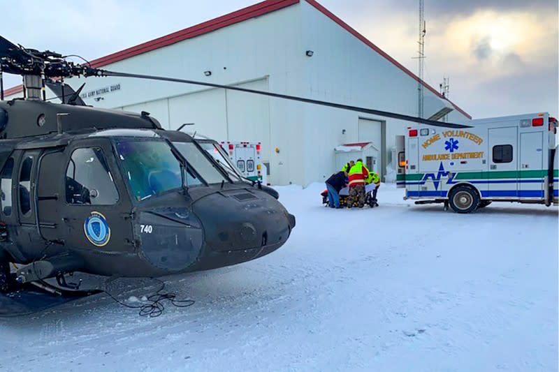 Three mushers from the Iditarod dog sled race are rescued by an aircrew of an Alaska Army National Guard near Nome