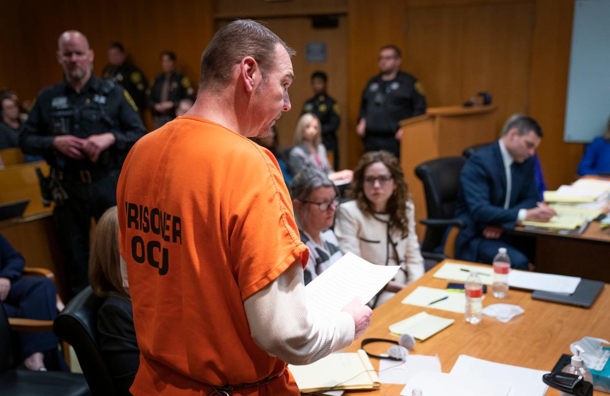 James Crumbley, left, reads a statement in Judge Cheryl Matthews Oakland county courtroom on Tuesday, April 9, 2024, during his sentencing. Crumbley is father of the of the 2021 Oxford High School shooter and was found guilty on four counts of involuntary manslaughter.