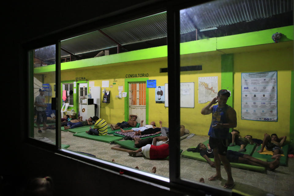 Male migrants bed down for the night on mattresses on the ground in the entry court of the Good Shepherd shelter in Tapachula, Mexico, Tuesday, June 18, 2019. Religious groups, mostly Catholic but including some Protestant denominations, have long operated shelters to aid migrants. (AP Photo/Rebecca Blackwell)