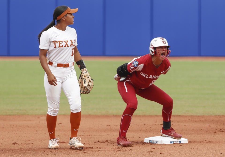 Oklahoma's Jayda Coleman (24) celebrates after reaching second base during the first inning of an NCAA Women's College World Series softball game against Texas on Saturday, June 4, 2022, in Oklahoma City. (AP Photo/Alonzo Adams)