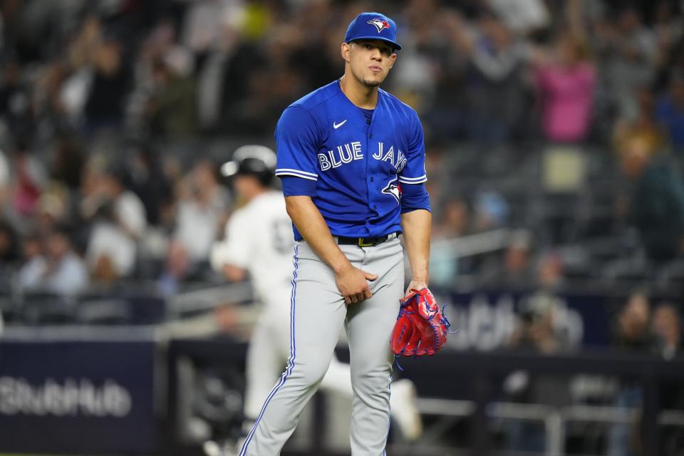 Toronto Blue Jays starting pitcher Jose Berrios reacts as New York Yankees' Jake Bauers runs the bases on a three-run home run during the first inning of a baseball game Thursday, Sept. 21, 2023, in New York. (AP Photo/Frank Franklin II)