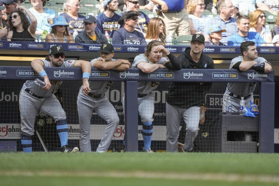 Pittsburgh Pirates players watch the final out of a baseball game against the Milwaukee Brewers Sunday, June 18, 2023, in Milwaukee. The Brewers won 5-2 to sweep the series. (AP Photo/Morry Gash)