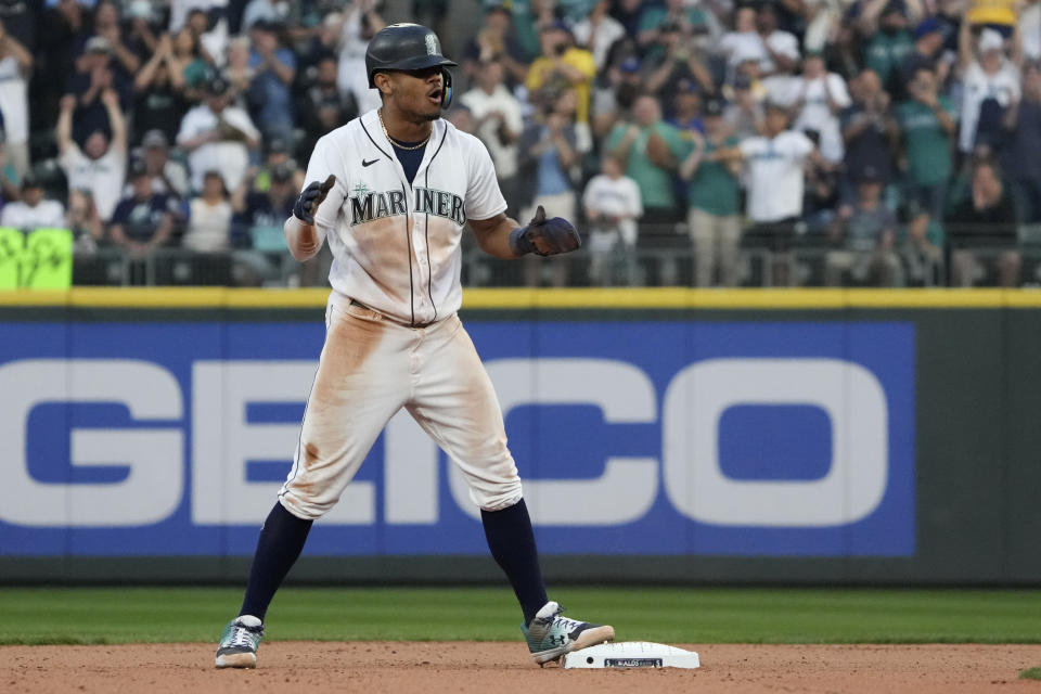 Seattle Mariners's Julio Rodriguez reacts after stealing second base during the 13th inning in Game 3 of an American League Division Series baseball game against the Houston Astros, Saturday, Oct. 15, 2022, in Seattle. (AP Photo/Ted S. Warren)