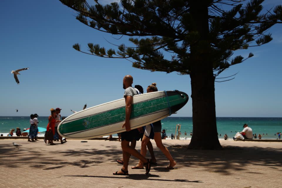 Swimmers, surfers and families flock to Manly beach, just a short ferry ride from the Sydney CBD. Photo: Getty