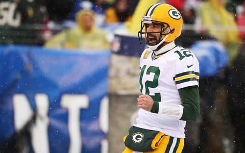 Aaron Rodgers #12 of the Green Bay Packers celebrates a touchdown throw to Allen Lazard #13 against the New York Giants during their game at MetLife Stadium on December 01, 2019 in East Rutherford, New Jersey - Credit: Getty Images