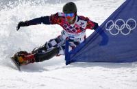 Russia's Vic Wild competes during his gold medal run during the men's snowboard parallel slalom final at the 2014 Sochi Winter Olympic Games in Rosa Khutor February 22, 2014. REUTERS/Mike Blake (RUSSIA - Tags: SPORT OLYMPICS SNOWBOARDING)