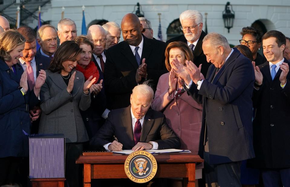 President Joe Biden signs the Infrastructure Investment and Jobs Act on Nov. 15, 2021.