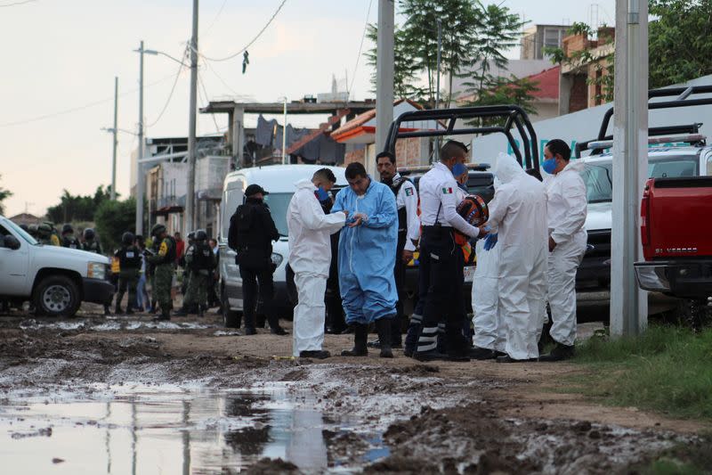 Forensic technicians are seen outside a drug rehabilitation facility where assailants killed several people, according to Guanajuato state police, in Irapuato