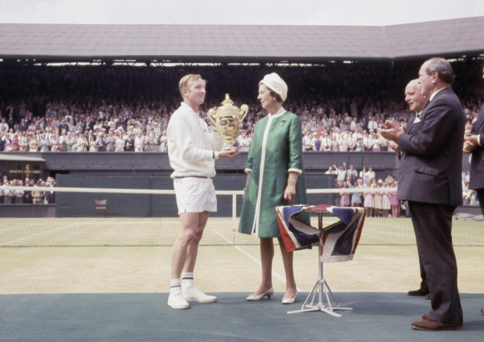 FILE - In this July 1968 file photo, Princess Marina presents Australia's Rod Laver with the trophy for winning the men's tennis final at Wimbledon, against Tony Roche. (AP Photo/Robert Dear, File)