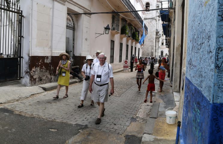 Tourists walk in Havana, Cuba