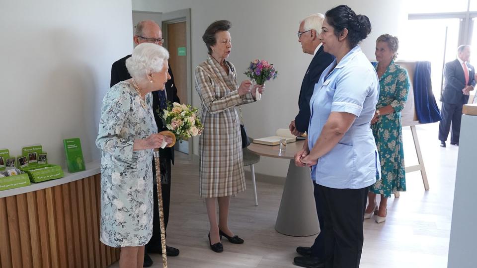 Queen Elizabeth II meeting staff during a visit to officially open the new building at Thames Hospice