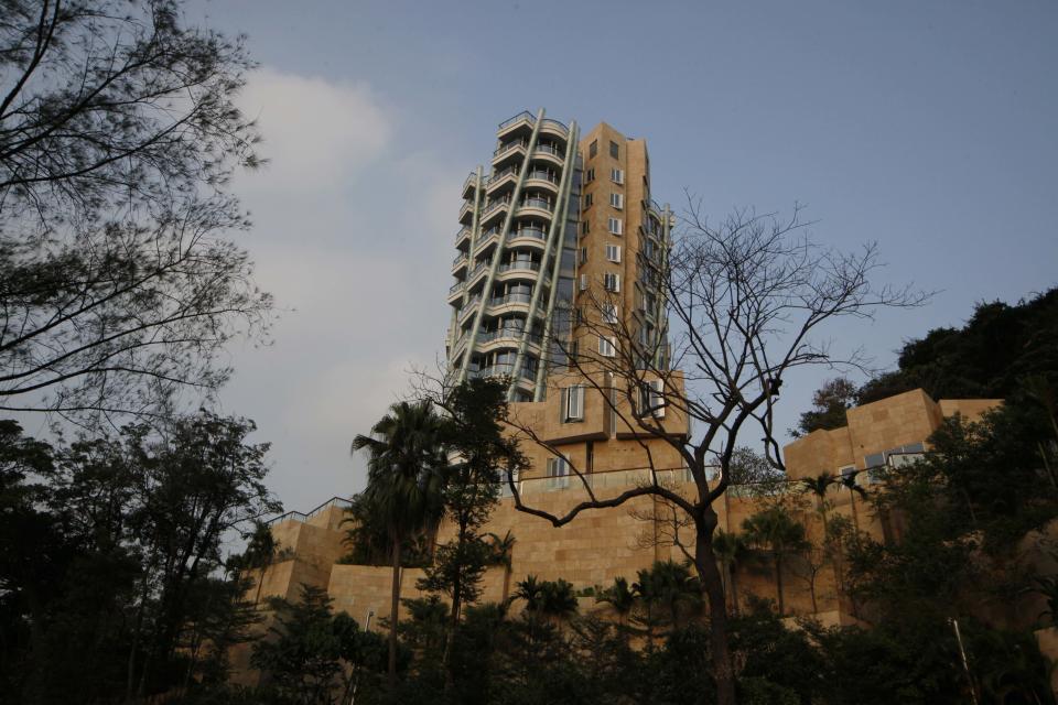 The luxury residential building "Opus Hong Kong," designed by Frank Gehry, stands in Mid-Levels East of Hong Kong Tuesday, Nov. 13, 2012. A Hong Kong property company has sold a luxury apartment in the Frank Gehry-designed building for an eye-popping price of nearly $60 million dollars. Swire Properties said Tuesday it sold the 620 square meter (6,683 square foot) apartment on the ninth floor of its Opus development for 455 million Hong Kong dollars ($58.7 million). It did not say who the buyer was. (AP Photo/Kin Cheung)