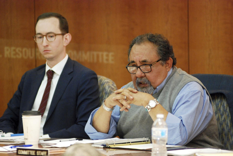 FILE - In this April 15, 2019 file photo U.S. Rep. Raul Grijalva, right, D-Ariz., speaks at a field hearing of a House Subcommittee on Energy and Mineral Resources in Santa Fe, N.M. A congressional committee is investigating whether the U.S. Interior Department helped an Arizona developer and supporter of President Donald Trump get a crucial permit. Grijalva is leading an investigation into the proposed 28,000-home development. The Arizona Democrat chairs the House Committee on Natural Resources. (AP Photo/Morgan Lee, File)