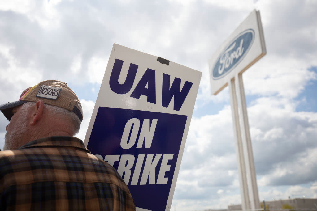  A striking auto worker outside the Ford factory 