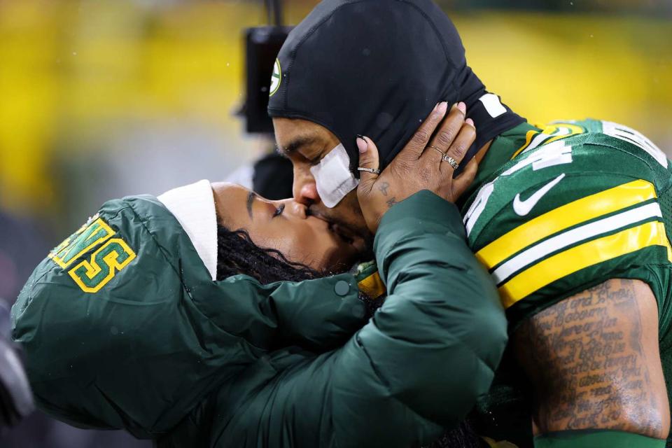 <p>Stacy Revere/Getty</p> Simone Biles and Jonathan Owens at Lambeau Field on December 3