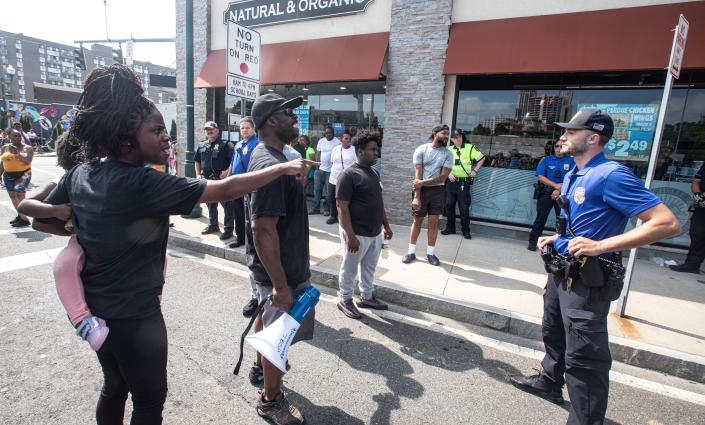 Protestors yell at New Rochelle police outside New Rochelle Farms on North Ave. in New Rochelle July 7, 2023 after Raymond Fowler the father of Jarrell Garris, spoke to the media about the shooting of his son by New Rochelle police this past Monday. Garris was shot by police during a scuffle on Lincoln Ave. in which police were attempting to arrest him after an employee of the market called the police about Garris possibly stealing food.