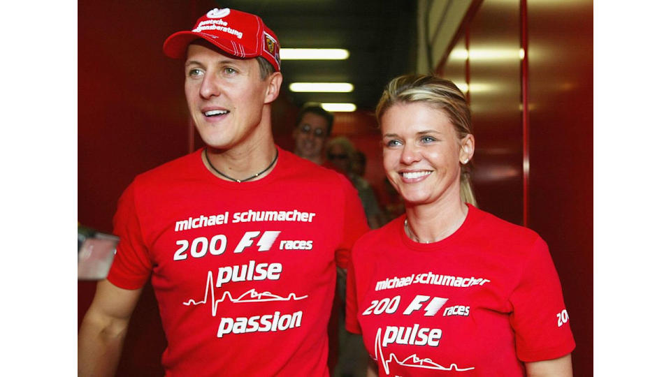 Michael Schumacher of Germany and Ferrari celebrates with his wife Corrina after competing in his 200th Grand Prix during the Spanish F1 Grand Prix on May 9, 2004, 