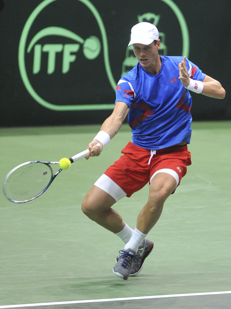 Tomas Berdych from the Czech Republic returns the ball to Igor Sijsling from the Netherlands during their Davis Cup first round singles match in Ostrava, Czech Republic, Friday, Jan. 31, 2014. (AP Photo,CTK/Jaroslav Ozana) SLOVAKIA OUT