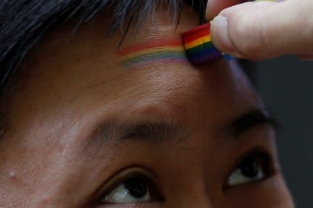 FILE PHOTO: A participant takes part in a Pride Run, an event of the ShanghaiPRIDE LGBT celebration in Shanghai, China June 17, 2017. REUTERS/Aly Song