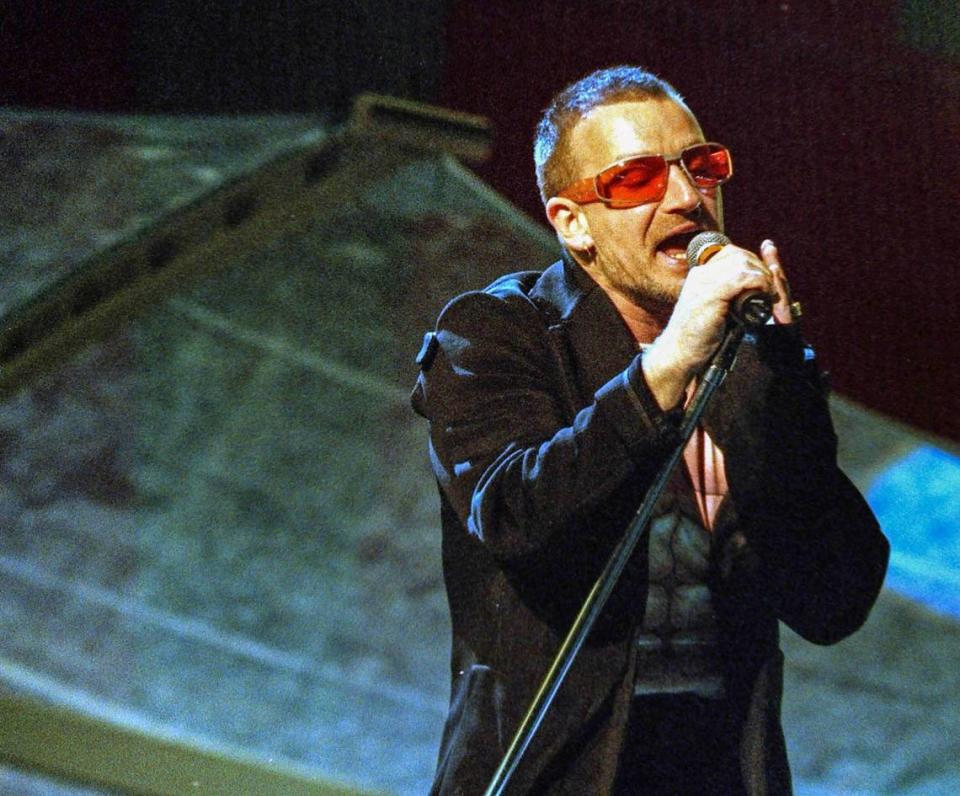 Lead singer Paul “Bono” Hewson of rock band U2, sings on stage on The Pop Mart Tour stop at Memorial Stadium in Clemson May 16, 1997.