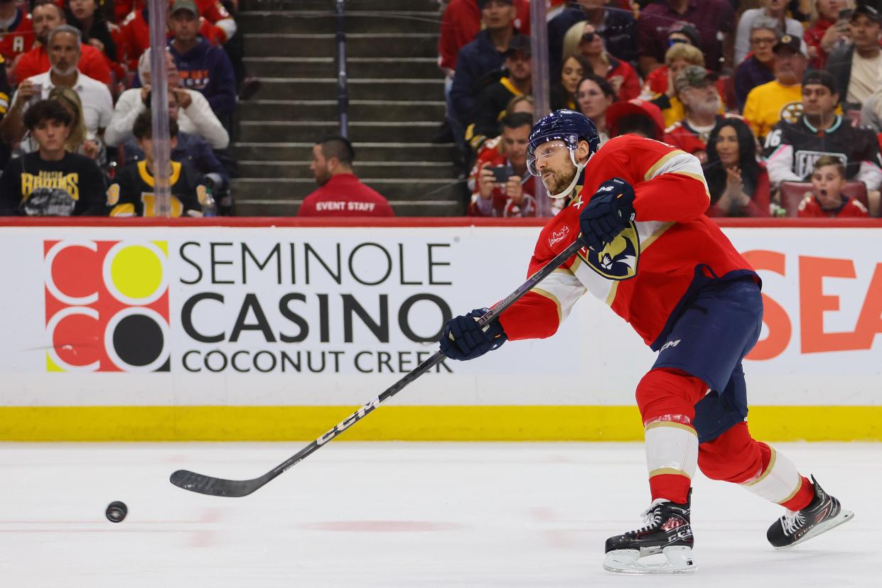 Florida Panthers center Sam Reinhart (13) shoots the puck against the Boston Bruins during the second period in game five of the second round of the 2024 Stanley Cup Playoffs at Amerant Bank Arena. Mandatory Credit: Sam Navarro-USA TODAY Sports