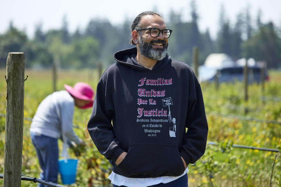 Edgar Franks talks about the farm worker union organizing at the Coopertiva Tierra y Libertad farm Friday, July 7, 2023, in Everson, Wash. Farms and workers must adapt to changing climate conditions. (AP Photo/John Froschauer)
