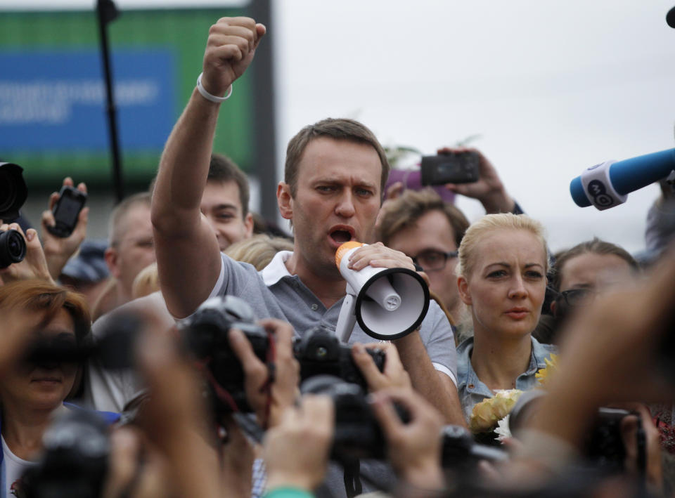 FILE - Russian opposition leader Alexei Navalny, center, addresses supporters and journalists after arriving from Kirov at a railway station in Moscow, Russia, Saturday, July 20, 2013. Navalny was the most well-known Russian opposition leader and his death in a prison colony has dealt it a heavy blow as President Vladimir Putin’s biggest political foe has been silenced forever. There is no anti-war candidate on the ballot to give Putin even a token challenge in next month’s election for a sixth term, and most of the opposition is scattered abroad in exile, or in prison at home. (AP Photo/ Dmitry Lovetsky, File)