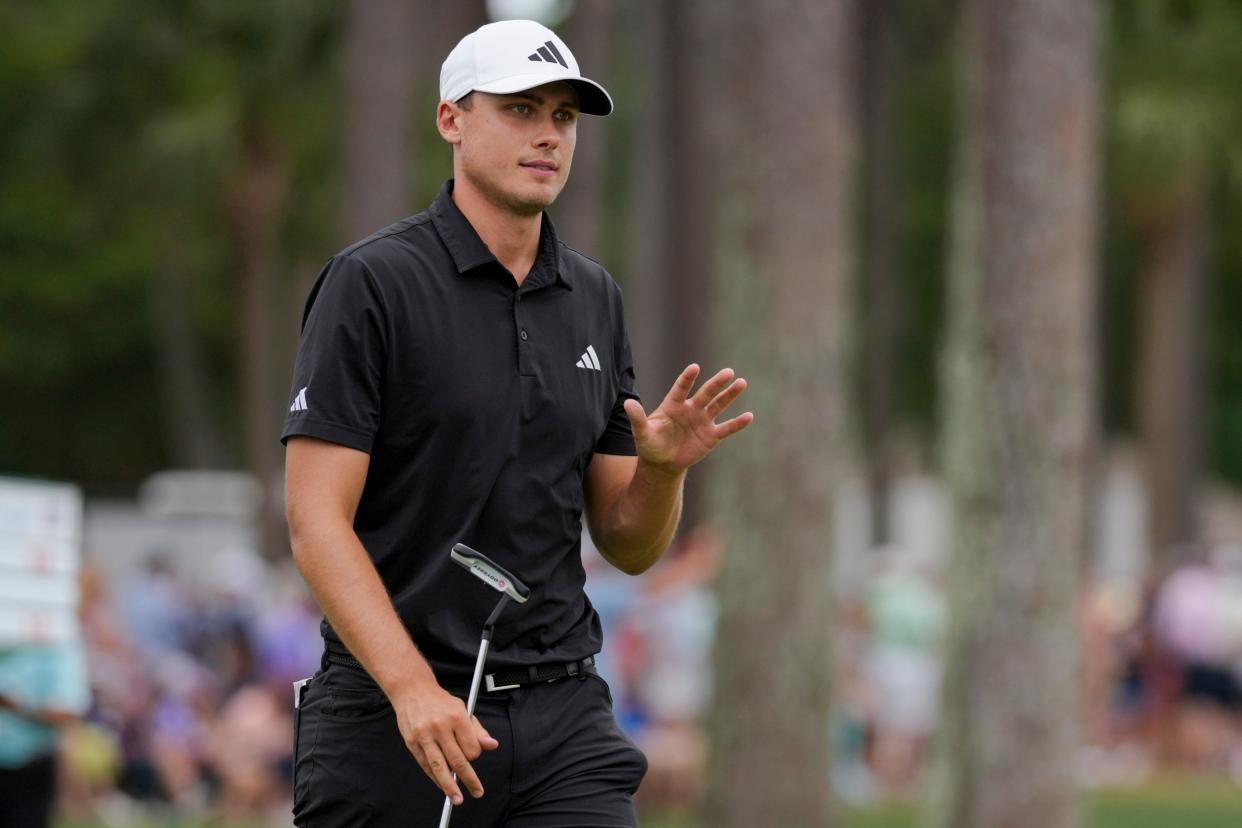 Apr 21, 2024; Hilton Head, South Carolina, USA; Ludvig Aberg acknowledges the fans after making a putt on the ninth green during the final round of the RBC Heritage golf tournament. Mandatory Credit: Aaron Doster-USA TODAY Sports