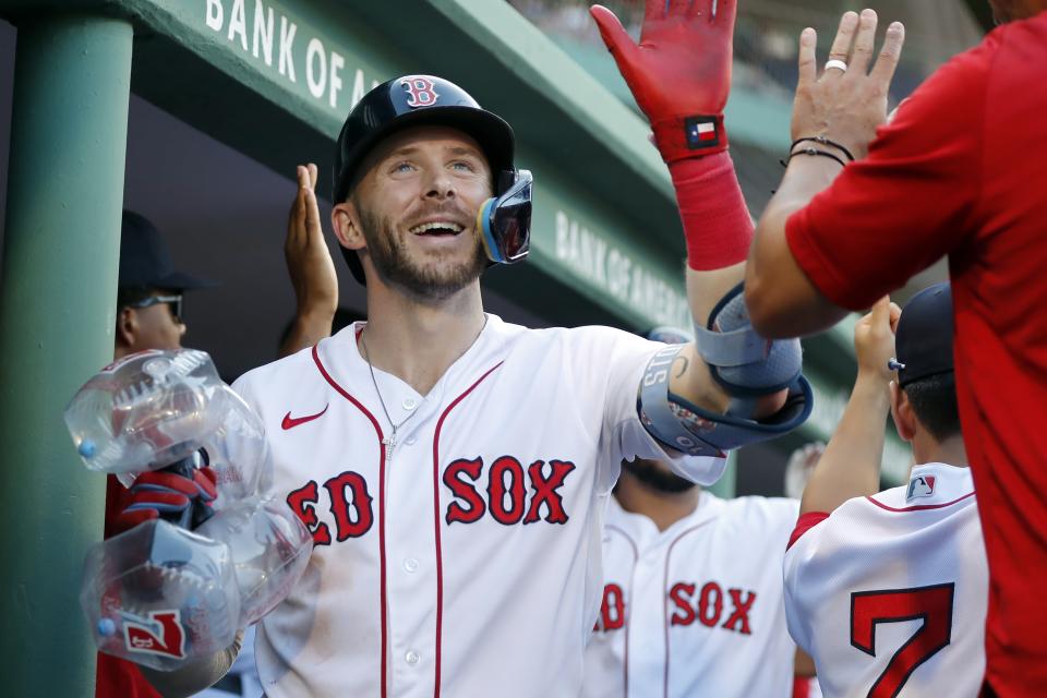 Boston Red Sox's Trevor Story celebrates his three-run home run in the eighth inning during the first game of a baseball doubleheader against the New York Yankees in Boston, Thursday, Sept. 14, 2023. (AP Photo/Michael Dwyer)