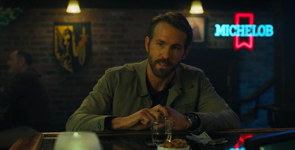 Adult Adam sitting at a bar in "The Adam Project"