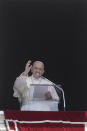 Pope Francis delivers his blessing as he recites the Angelus noon prayer from the window of his studio overlooking St.Peter's Square, at the Vatican, Sunday, June 7, 2020. Pope Francis is cautioning people in countries emerging from lockdown to keep following authorities’ rules for COVID-19 contagion containment. Says Francis: “Be careful, don’t cry victory, don’t cry victory too soon.” (AP Photo/Andrew Medichini)