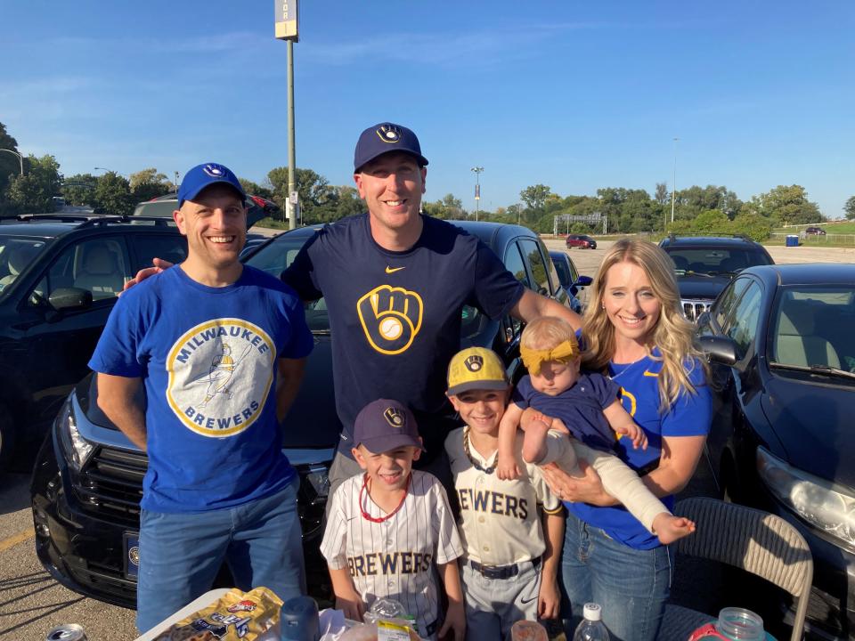 Mark Matanaer, center, and his wife Vanessa have brought their children to each Milwaukee Brewers playoff Game 1 since the oldest, William, was born. They were joined by friend Marc Casati.