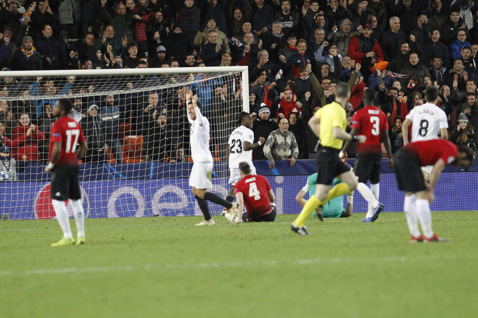 Valencia players celebrate after Manchester United's Phil Jones, center, scores an own goal during a Group H Champions League soccer match between Valencia and Manchester United at the Mestalla Stadium in Valencia, Spain, Wednesday, Dec. 12, 2018. (AP Photo/Alberto Saiz)