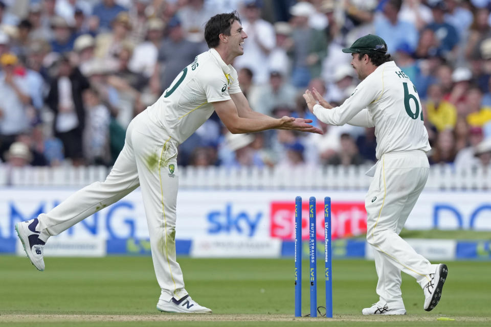 Australia's captain Pat Cummins, left, celebrates with teammate Travis Head after the dismissal of England's Harry Brook during the fourth day of the second Ashes Test match between England and Australia, at Lord's cricket ground in London, Saturday, July 1, 2023. (AP Photo/Kirsty Wigglesworth)