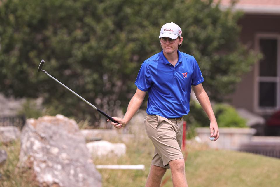 Westlake's Sean-Karl Dobson gestures to spectators after a putt at the UIL Class 6A State Championship at Legacy Hills Golf Club in Georgetown on Monday. The Chaparrals, seeking a fifth straight title, lead Plano West by 12 shots after the first round of play.