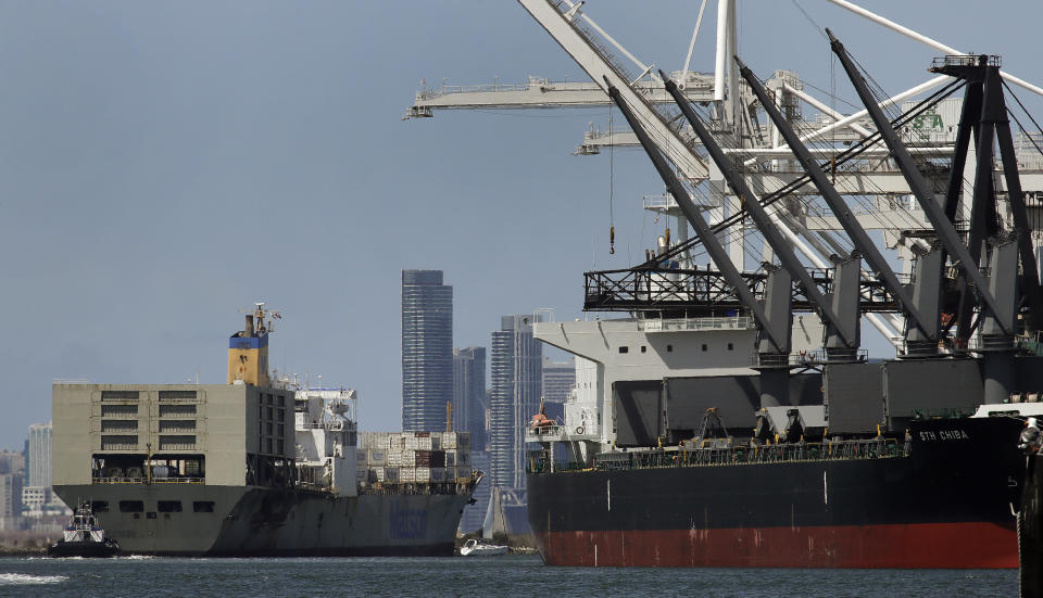 FILE - In this May 17, 2019, file photo, a tugboat assists as a container ship is prepared for docking at the Port of Oakland in Oakland, Calif. The president of the Oakland City Council in the San Francisco Bay Area is proposing bringing a cruise ship to the city's port to house up to 1,000 homeless people. (AP Photo/Ben Margot,File)