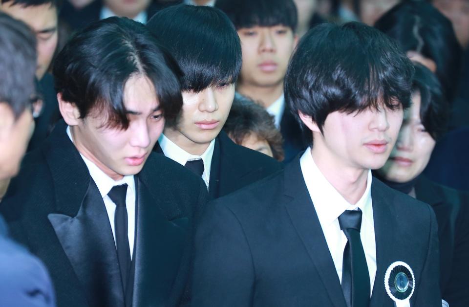 Jonghyun’s SHINee bandmates at his funeral earlier today. Copyright: [Rex]