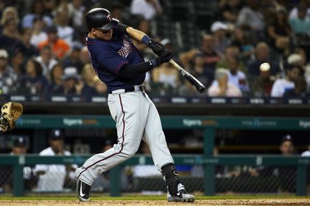 Sep 18, 2018; Detroit, MI, USA; Minnesota Twins designated hitter Tyler Austin (31) hits an RBI single in the sixth inning against the Detroit Tigers at Comerica Park. Mandatory Credit: Rick Osentoski-USA TODAY Sports