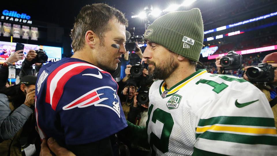 Tom Brady #12 of the New England Patriots talks with Aaron Rodgers #12 of the Green Bay Packers after the Patriots defeated the Packers 31-17 at Gillette Stadium on November 4, 2018 in Foxborough, Massachusetts.