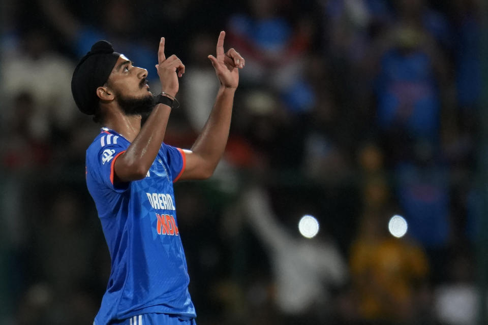India's Arshdeep Singh celebrates after bowling the last delivery to win the fifth T20 cricket match against Australia in Bengaluru, India, Sunday, Dec. 3, 2023. (AP Photo/Aijaz Rahi)